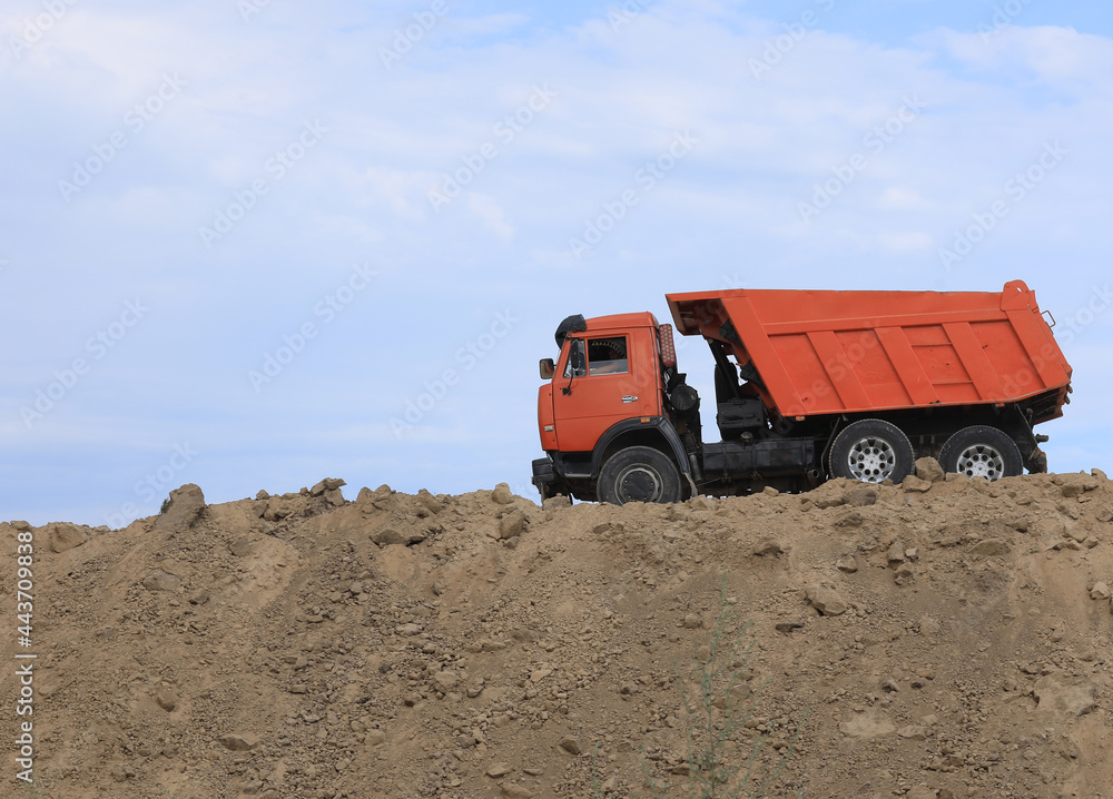 dump truck carries land in summer