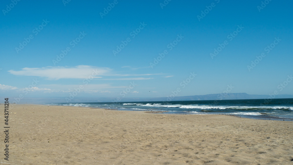 
seashore in the summer sun, beautiful scenery, straw umbrellas