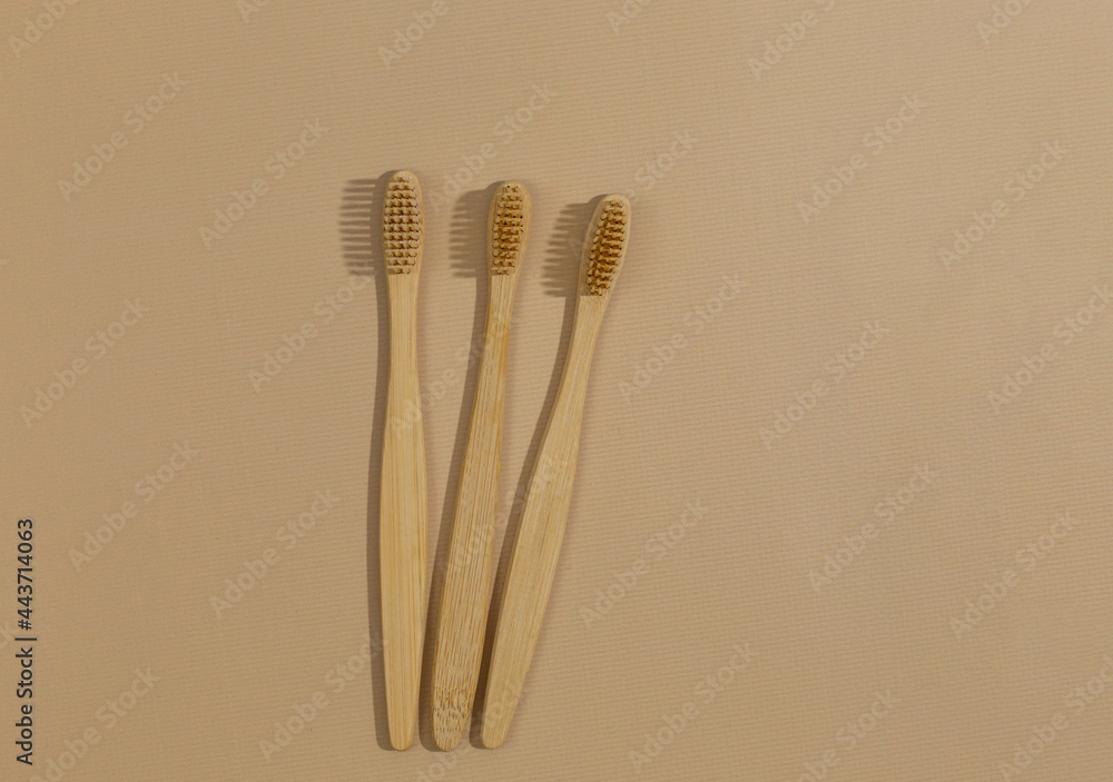 A set of eco friendly bamboo toothbrushes on a beige pastel background. Zero waste, Sustainable lifestyle. Plastic free concept A set of eco friendly bamboo toothbrushes on a beige pastel background. Zero waste, Sustainable lifestyle. Plastic free concept