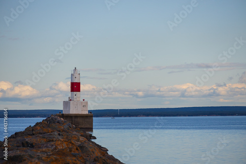 Presque Isle Harbor Lighthouse at the end of  the breakwater at Lake Superior, Michigan, USA © Martina