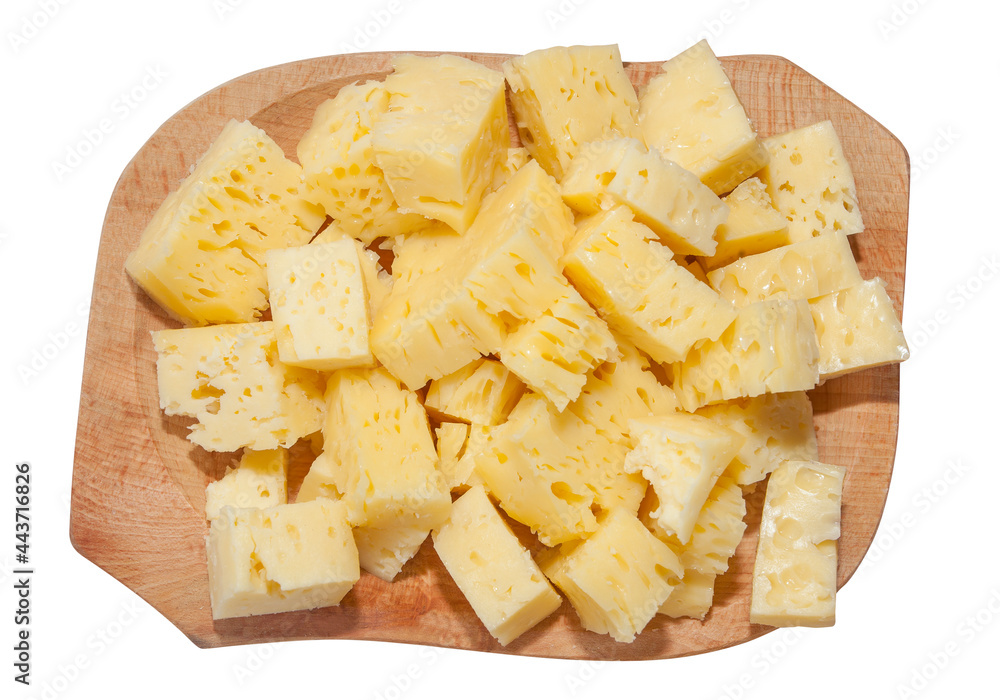 cheese cubes on a wooden plate. Romania traditional food isolated on white
