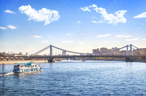 Crimean bridge and a pleasure boat on the Moskva River in Moscow