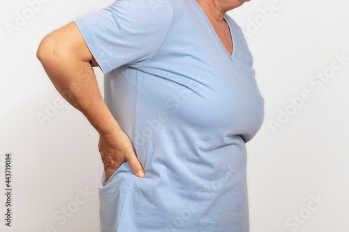 Wallpaper Mural woman low back pain, isolated on white background, healthcare and medicine concept.
 Torontodigital.ca