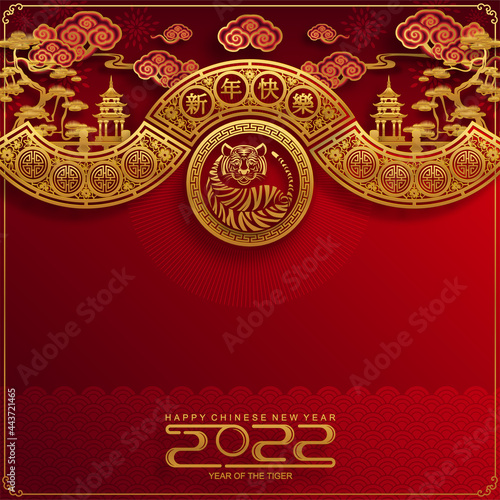 Chinese new year 2022 year of the tiger red and gold flower and asian elements paper cut with craft style on background.( translation : chinese new year 2022, year of tiger )