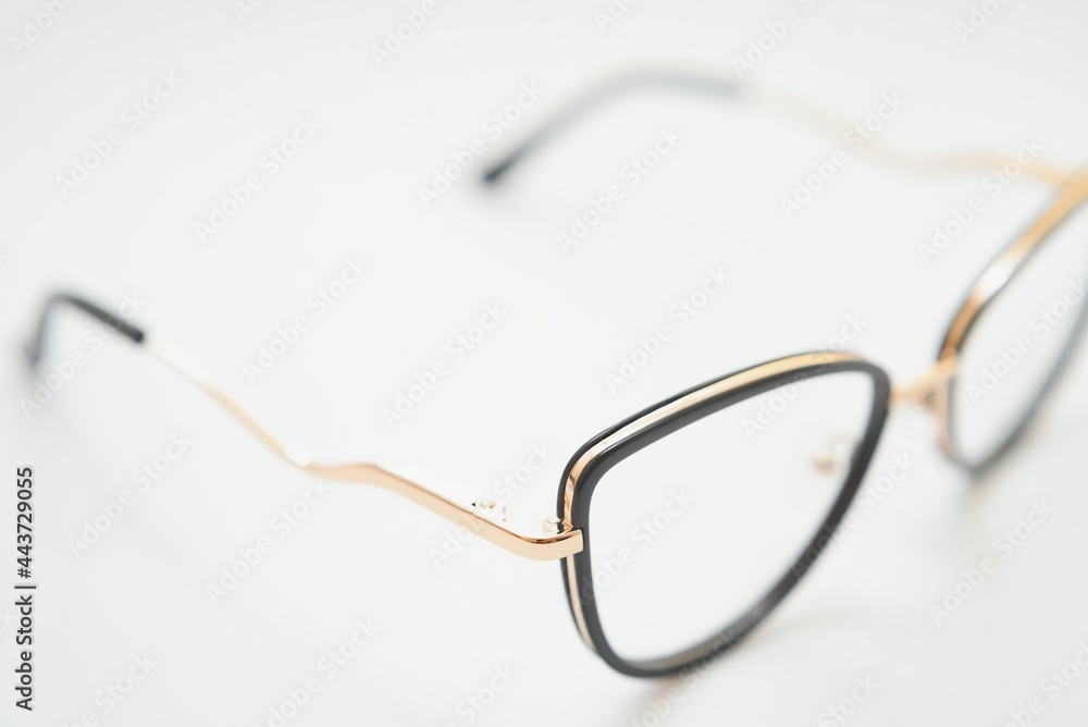 Female eyeglasses macro detail over a white background. Horizontal Female eyeglasses macro detail over a white background. Horizontal