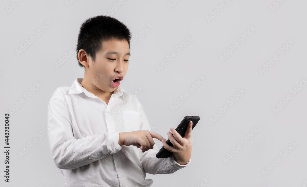 Asian boys studio portrait on gray background Asian boys studio portrait on gray background
