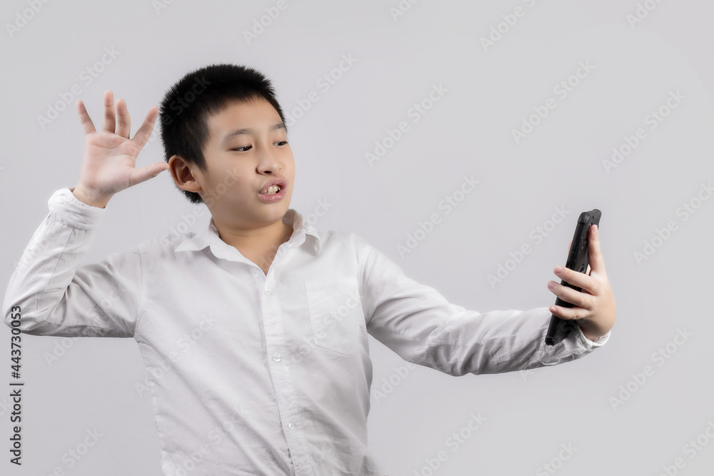 Fototapeta premium Asian boys studio portrait on gray background