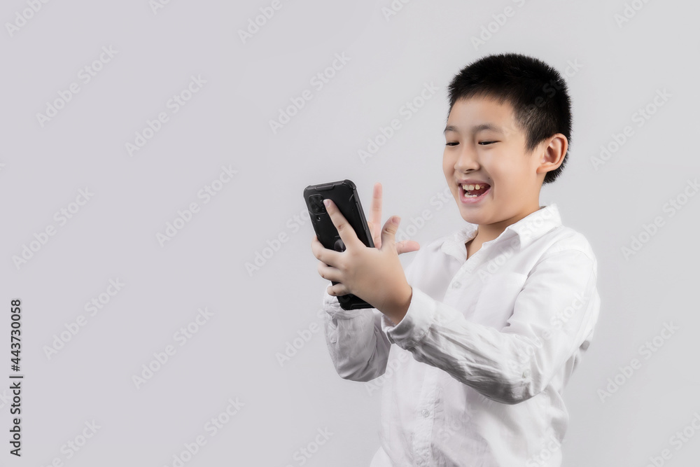 Asian boys studio portrait on gray background Asian boys studio portrait on gray background