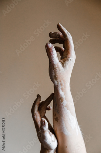 Female ceramist hands sculpt clay dishes