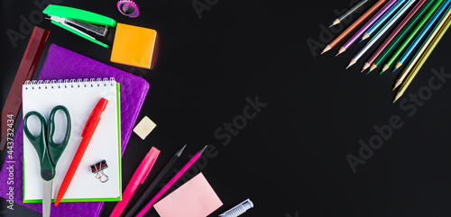 Back to school concept. Office supplies on chalkboard background. Banner format