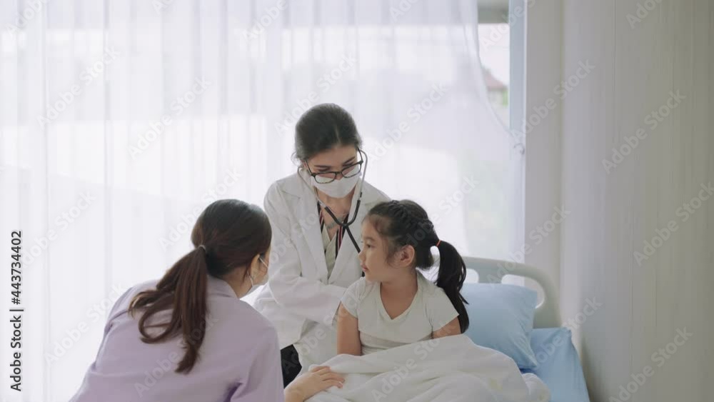 The pediatrician is talking to the patient and questioning the patient with the child's mother sitting nearby.
The pediatrician is talking to the patient and questioning the patient with the child's mother sitting nearby.
