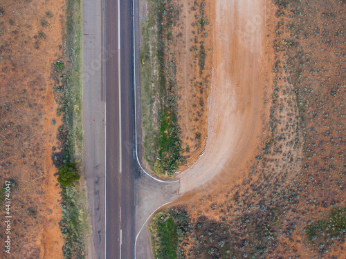 Birds eye view of Dirt road meeting the main road. South Australia outback. © MK3 Design