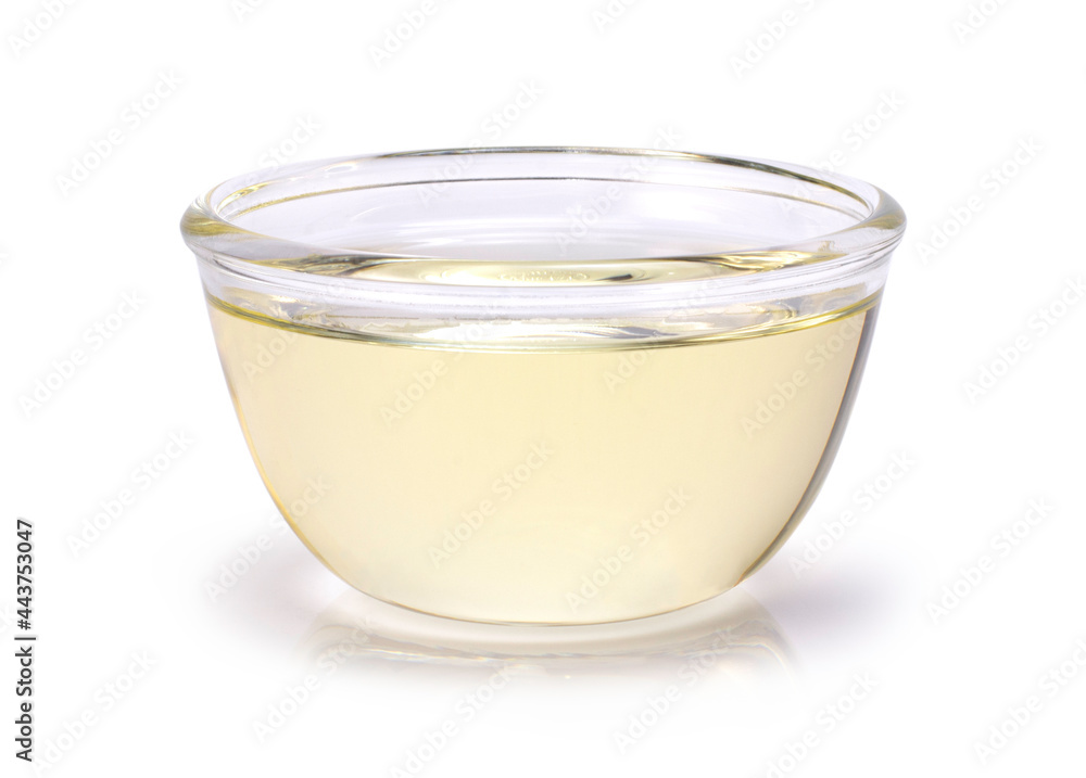 Oil in glass bowl isolated on white background. Clipping path. Oil in glass bowl isolated on white background. Clipping path.