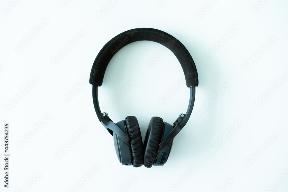 Fototapeta premium Modern wireless on ear headphones on white table close up. Professional stereo wireless headphone.