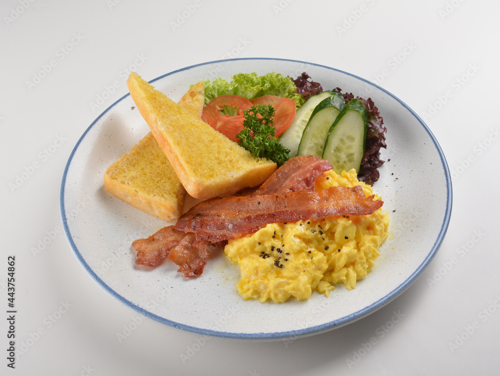 western big breakfast with butter toast, fried scramble egg, sausage, grill bacon, ham, omelette, bean and salad halal breakfast menu 