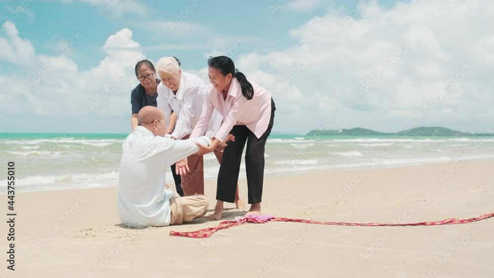 Group of elderly people having fun playing sports on the beach. Group of elderly people having fun playing sports on the beach.