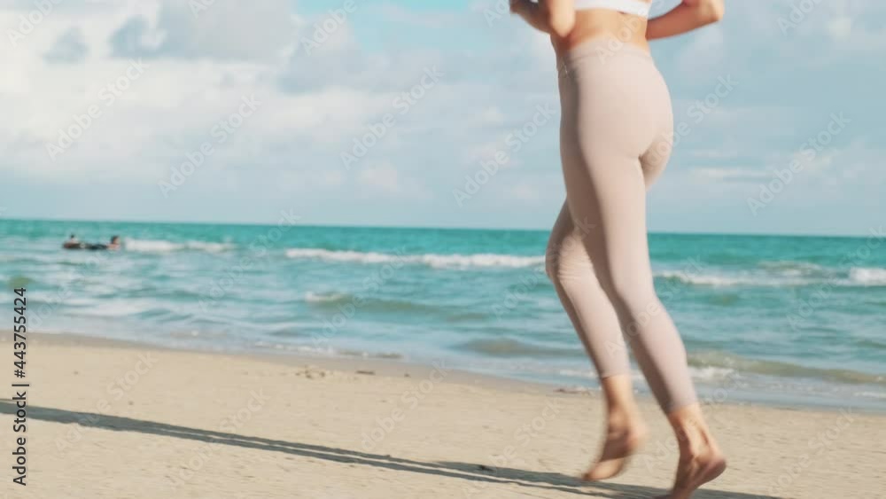 Women exercising on the beach happily Women exercising on the beach happily