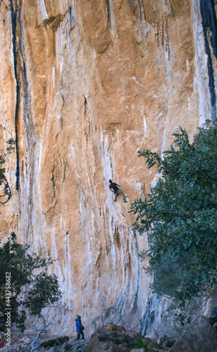 a girl insures a climber a man photo