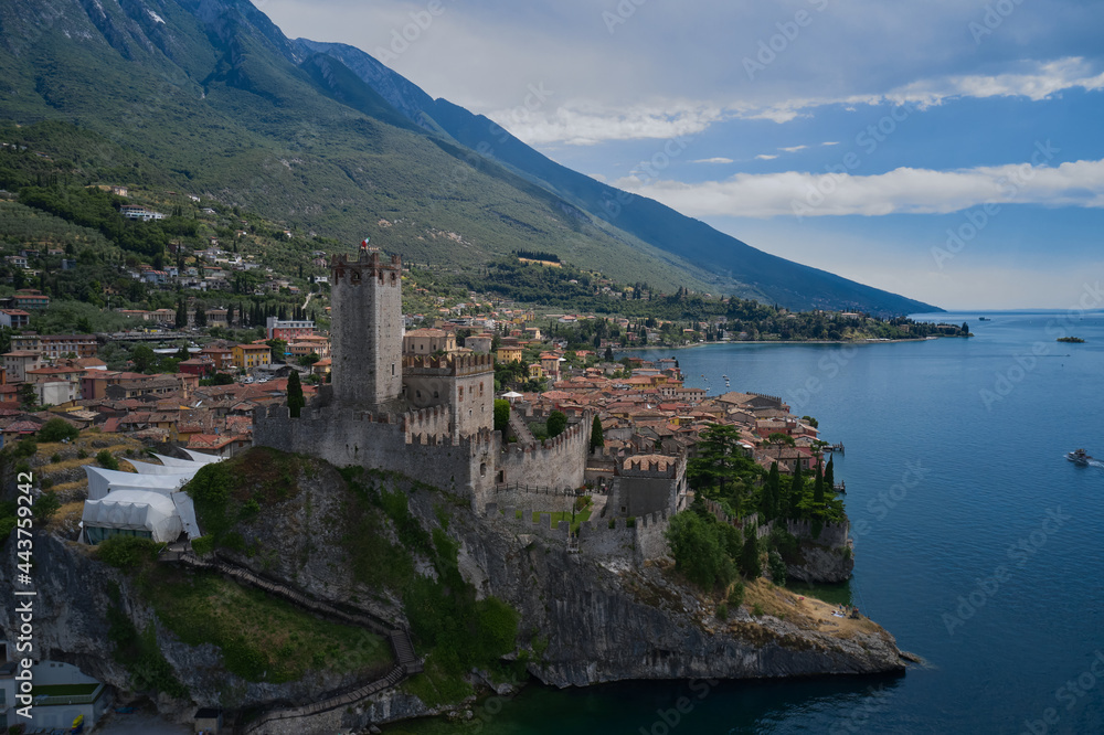 Castle on Lake Garda top view. The historic town of Malcesine on Lake Garda, Italy. Castle of Malcesine, panorama aerial view.