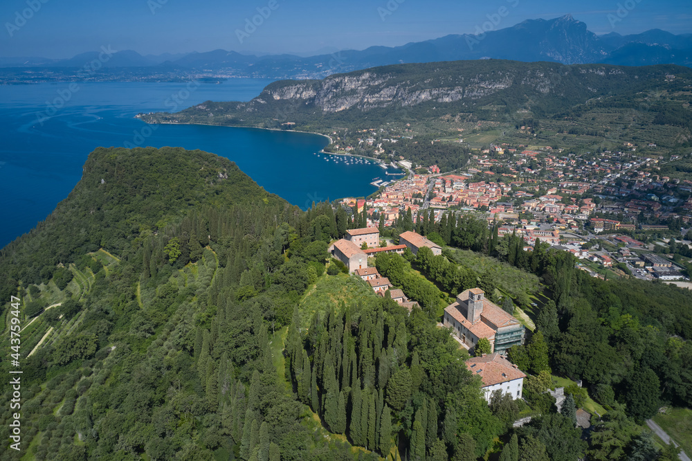 Aerial panorama Monastery on the hill. Home of Italian monks, lake garda. Monastery on the Eremo di San Giorgio hill,.Lake Garda, Italy. Aerial view of Eremo di San Giorgio, Bardolino.