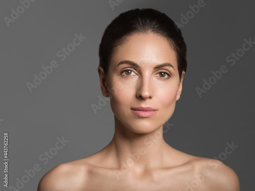 Beautiful woman healthy clean skin natural make up healthy teeth smile brunette female model