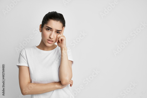 woman holding her head health problems migraine lifestyle medicine