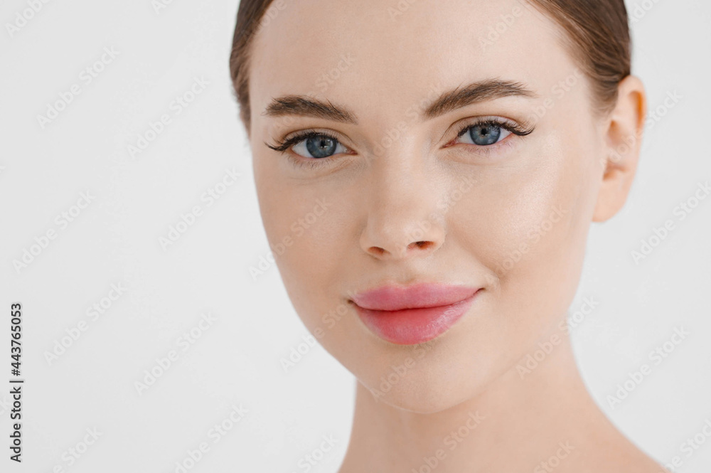 Beautiful woman face healthy skin natural make up lips close up blue eyes Beautiful woman face healthy skin natural make up lips close up blue eyes
