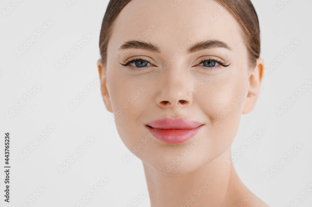 Beautiful woman face healthy skin natural make up lips close up blue eyes Beautiful woman face healthy skin natural make up lips close up blue eyes