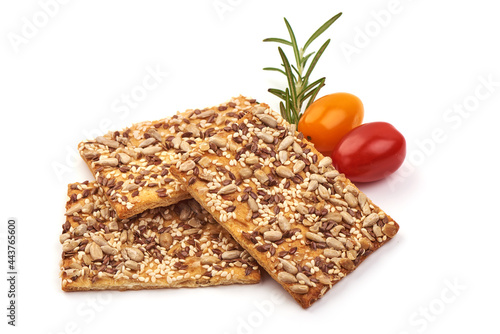 Wholegrain crispy bread with sunflower, linen and sesames seeds, isolated on white background. High resolution image. photo