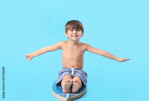 Cute little boy with surfbo...