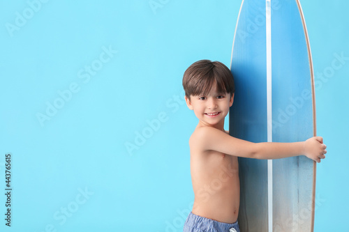 Cute little boy with surfbo...