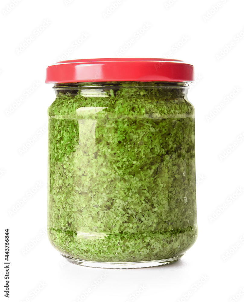 Jar with fresh pesto sauce on white background Jar with fresh pesto sauce on white background
