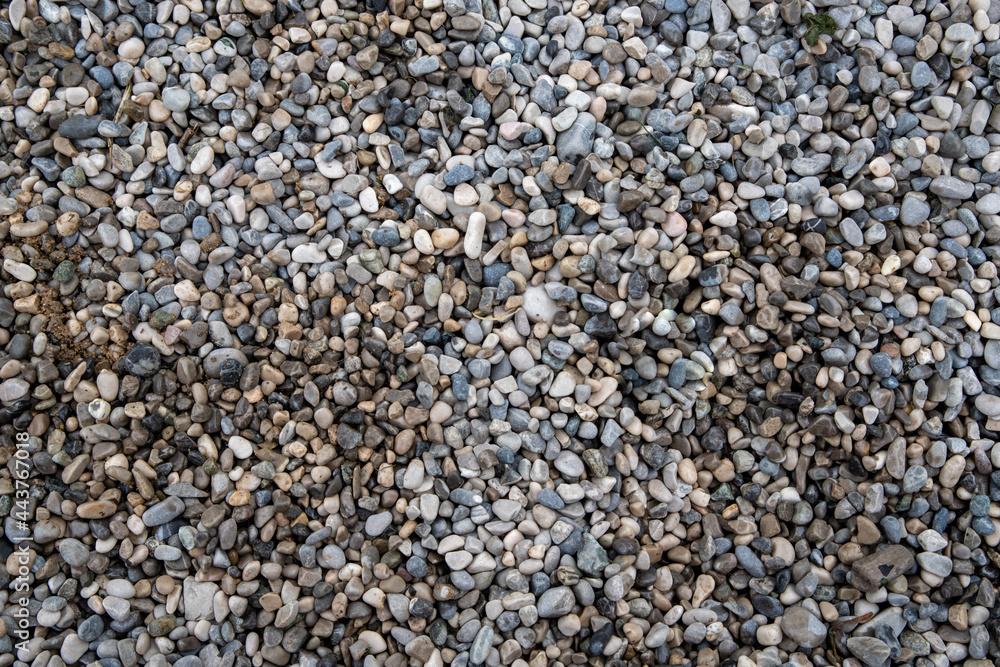 Little rocks, pebbles, texture of the road. Gray closeup natural elements for background, wallpaper. Partially wet. Little rocks, pebbles, texture of the road. Gray closeup natural elements for background, wallpaper. Partially wet.