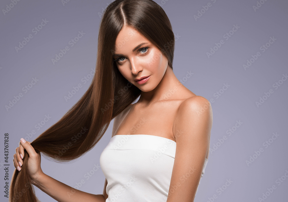 Beautiful woman with long beautiful smooth hair natural make up healthy skin
