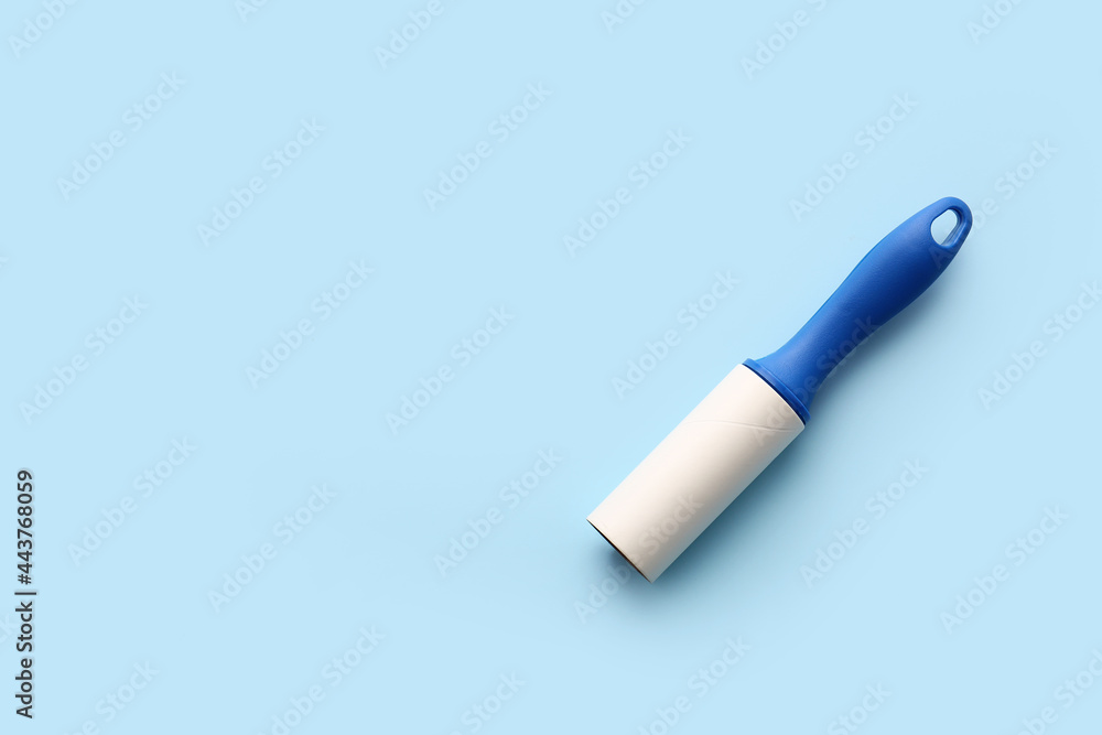 Lint roller on color background Lint roller on color background