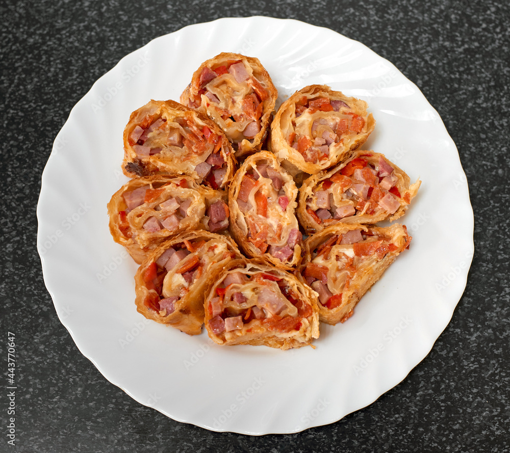 Puff pastry rolls stuffed with ham and red pepper. Top view Puff pastry rolls stuffed with ham and red pepper. Top view