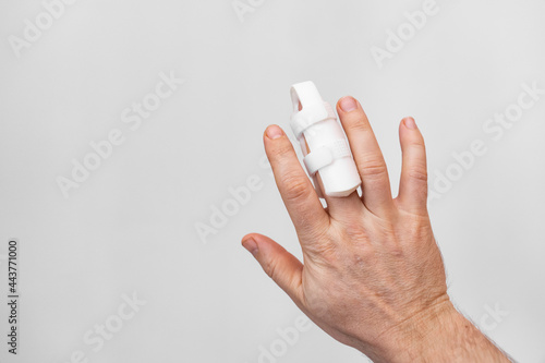 orthosis for fixing the finger on hand on a white background