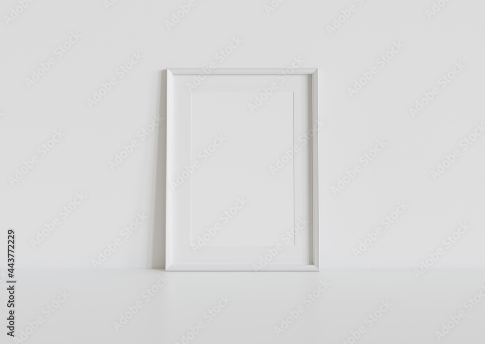 White frame leaning on white floor in interior mockup. Template of a picture framed on a wall 3D rendering White frame leaning on white floor in interior mockup. Template of a picture framed on a wall 3D rendering