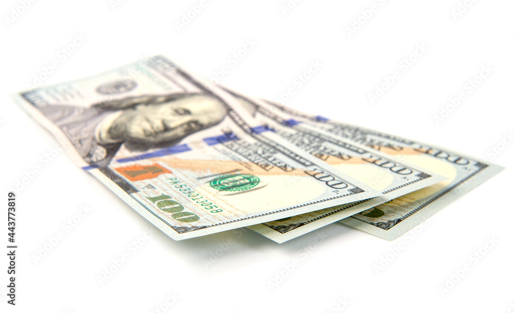 several hundred dollar bills fan-folded isolated on white background several hundred dollar bills fan-folded isolated on white background