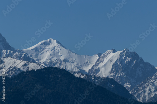 View of the mountain peaks, where huge blocks of snow hang