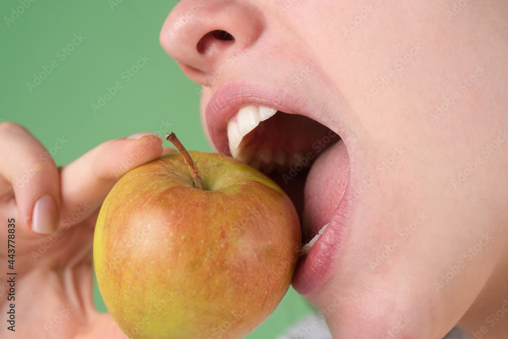Dental concept. Healthy white teeth close up with an apple. Dental concept. Healthy white teeth close up with an apple.