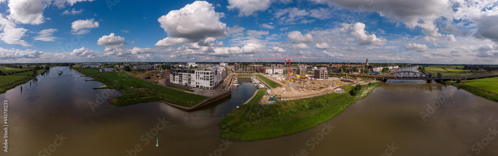 180 degrees aerial panoramic view on recreational port and Kade Zuid construction site of the new Noorderhaven neighbourhood along the river IJssel in Zutphen, The Netherlands