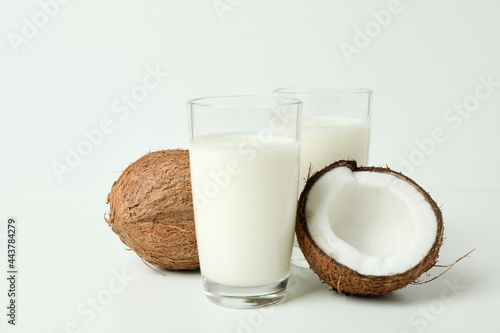 Concept of coconut milk on white background