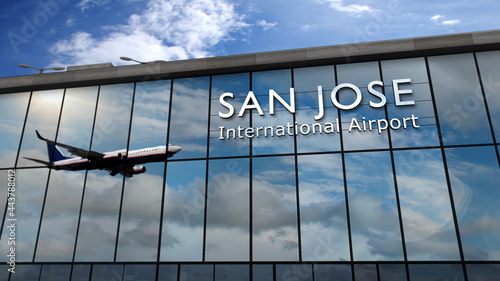 Airplane landing at San Jose California, Costa Rica airport mirrored in terminal