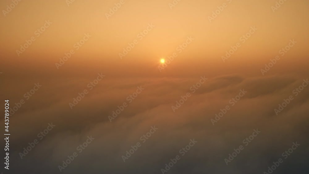 Sun over the smoky pollution clouds during sunrise. Environmental Concept. Sun over smog haze fog.