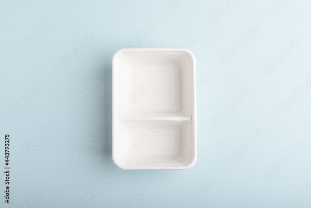 Biodegradable paper box on blue background. Eco-friendly sustainable products concept zero waste lifestyle. Minimalism simple and copy space Biodegradable paper box on blue background. Eco-friendly sustainable products concept zero waste lifestyle. Minimalism simple and copy space