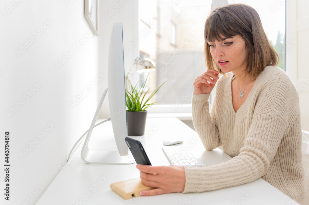 Beautiful professional businesswoman working with desktop computer in office. Photo of young woman sit indoors at home working on computer.