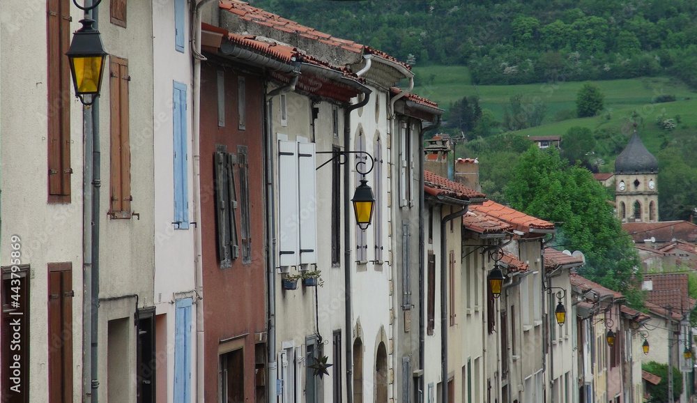 old street lamps on colorful buildings, Le Mas d'Azil, France