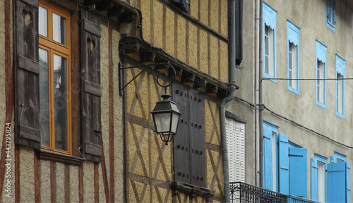 old street lamp on colorful buildings, Le Mas d'Azil, France © Georgios