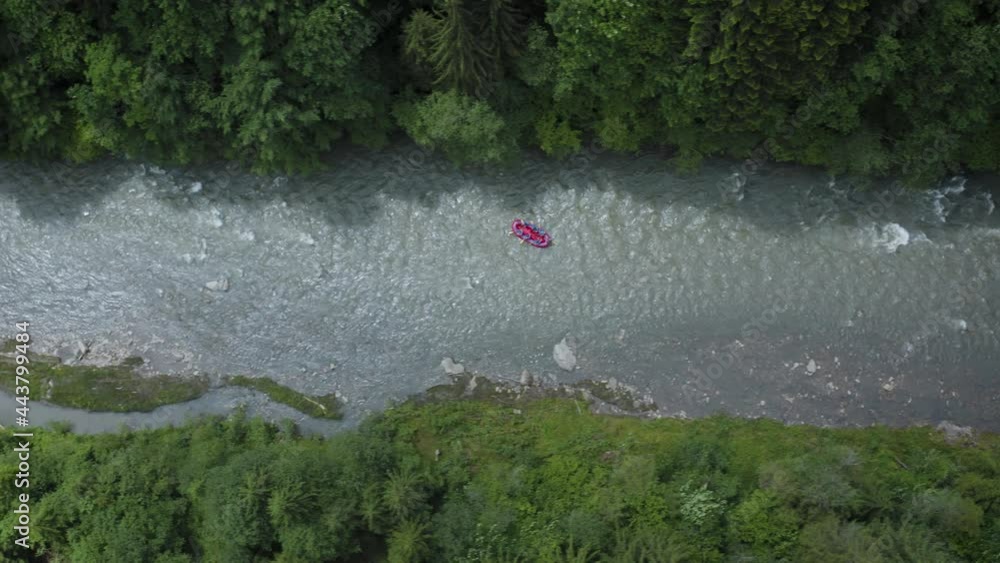 Areial view of group of people on a rafting trip in an rubber dinghy Areial view of group of people on a rafting trip in an rubber dinghy